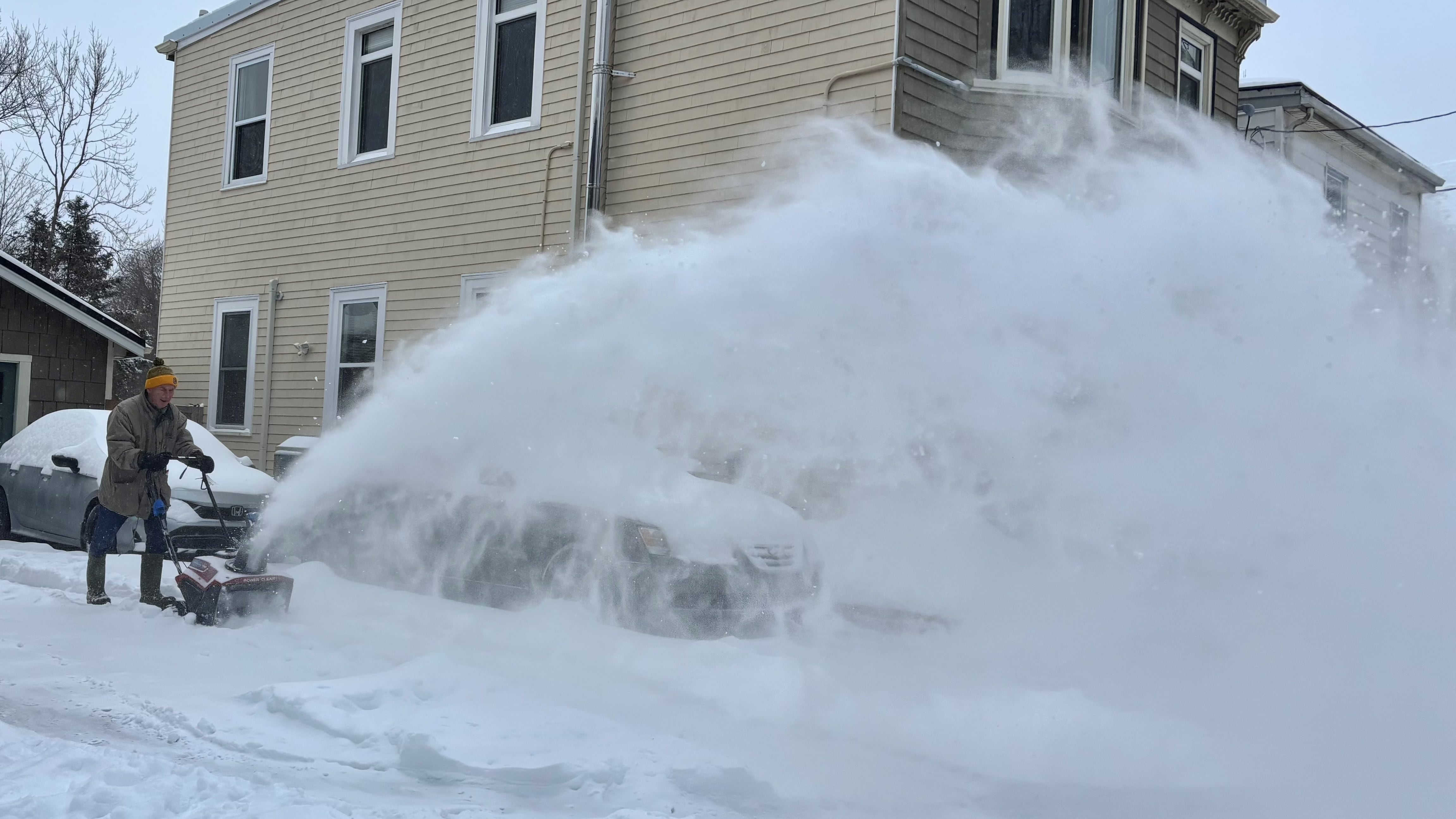 A man snow blows his driveway on Charles Street in Halifax on Jan. 26, 2026. (Jesse Thomas/CTV Atlantic)