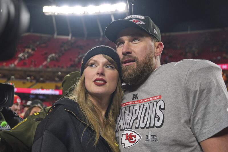 Kansas City Chiefs tight end Travis Kelce, right, appears with singer Taylor Swift after the Chiefs' victory over the Buffalo Bills in the AFC Championship game in Kansas City, Mo., on  Jan. 26, 2025. (Charlie Riedel / AP Photo)