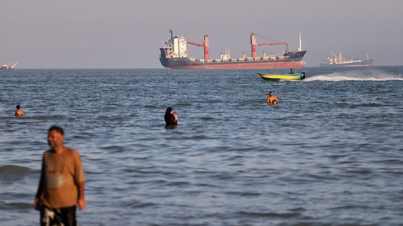 British military says ship was hit by projectile on UN-approved route through the Strait of Hormuz