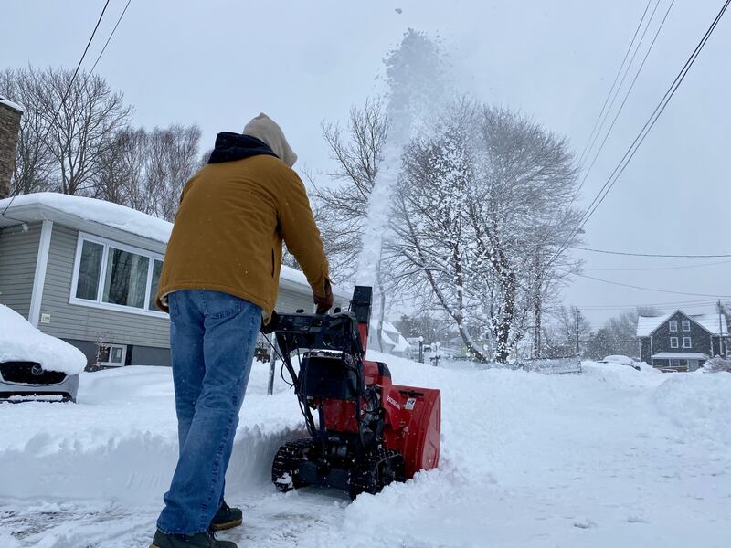 A man pushes a snowblower in Sydney, N.S., on Feb. 12, 2026. (CTV Atlantic / Darryl Reeves)