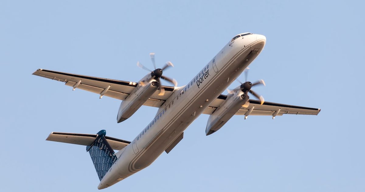 Photo: CP24 Toronto, Canada - Oct 17, 2017: Porter Airlines Bombardier Dash 8 departing from the Billy Bishop Toronto City Airport