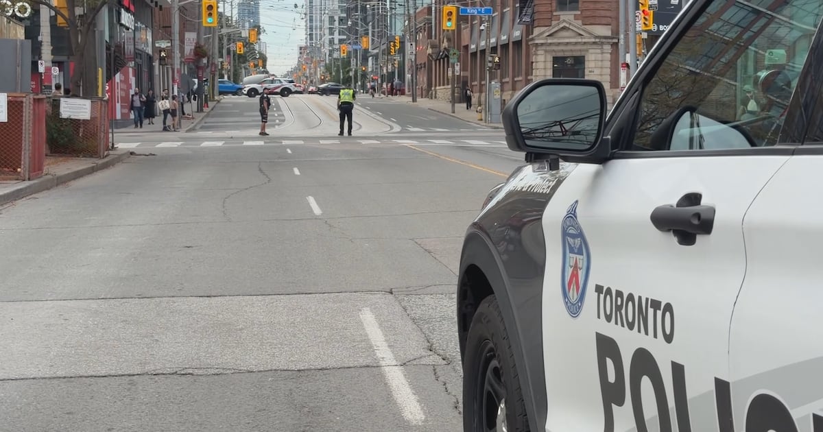Cyclist taken to hospital after collision with police car in downtown Toronto
