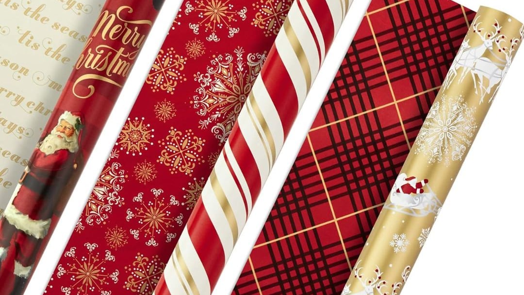 Three rolls of Hallmark | Reversible Wrapping Paper.