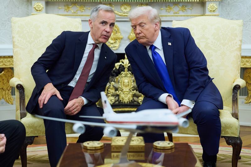 President Donald Trump meets with Canadian Prime Minister Mark Carney in the Oval Office of the White House, Tuesday, Oct. 7, 2025, in Washington. (AP Photo/Evan Vucci)