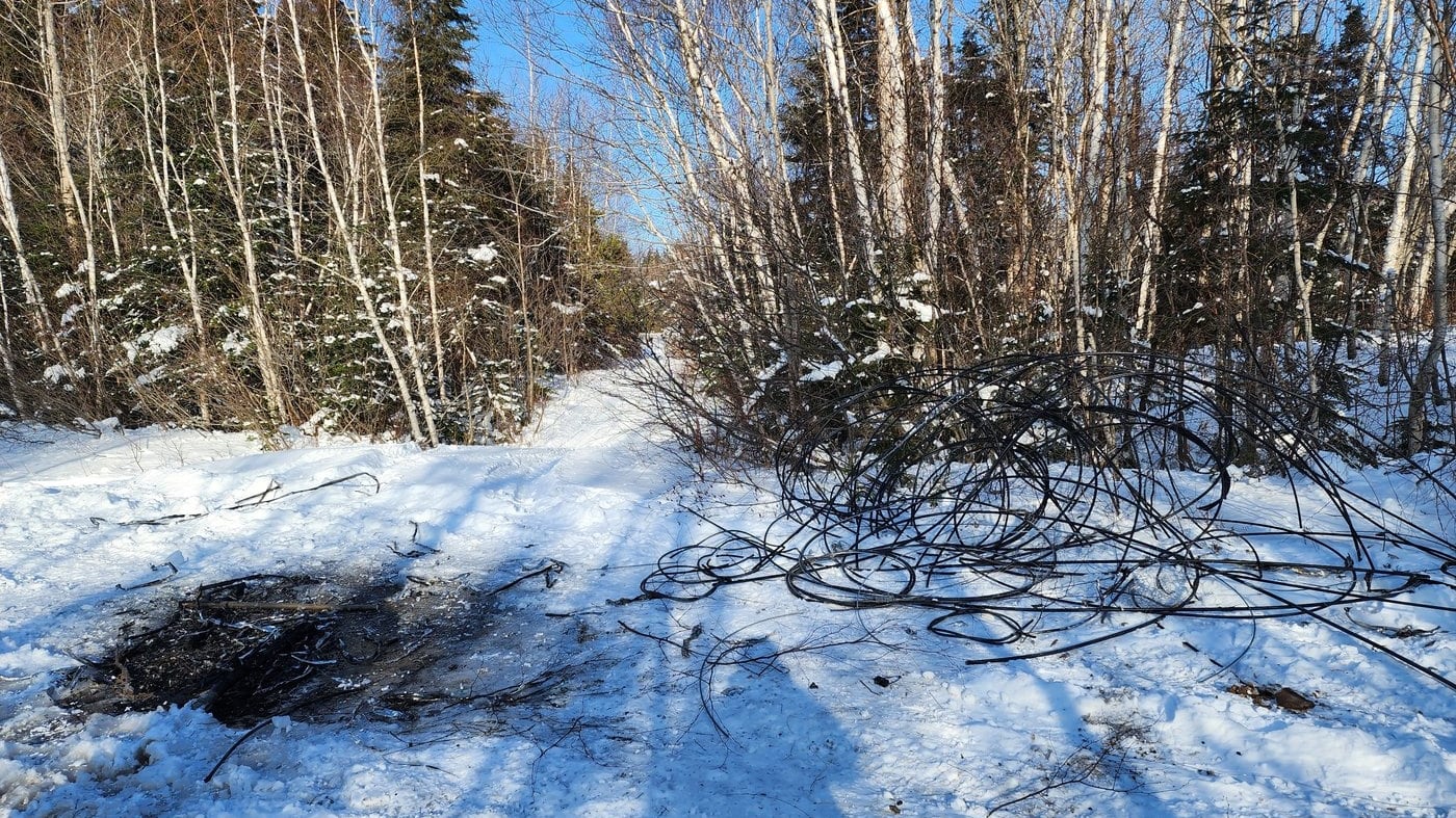 Cut Bell Canada wire is shown in this photo from Jan. 3, 2026, after thieves stole about a kilometre of wire near Clarendon, N.B. THE CANADIAN PRESS/Handout-Bell Canada