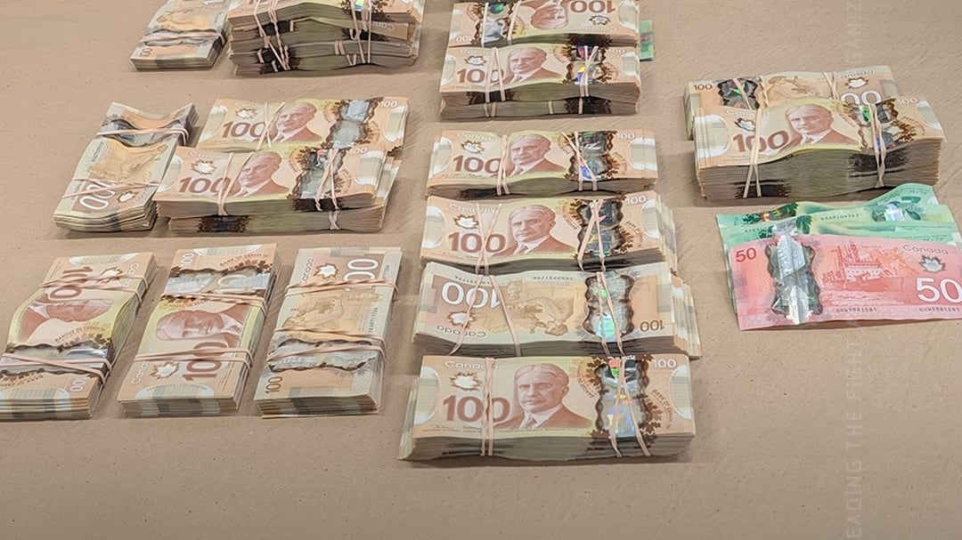 Officers seized approximately $330,000 in cash believed to be proceeds of crime, police said. (Handout)
