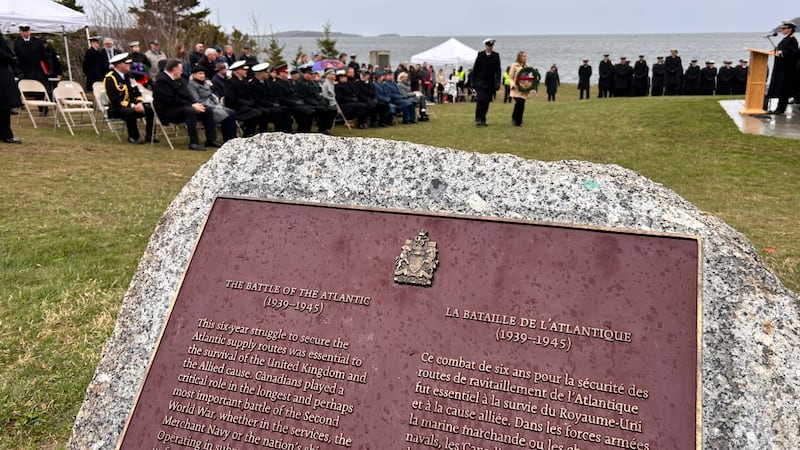 A plaque on a rock is pictured.