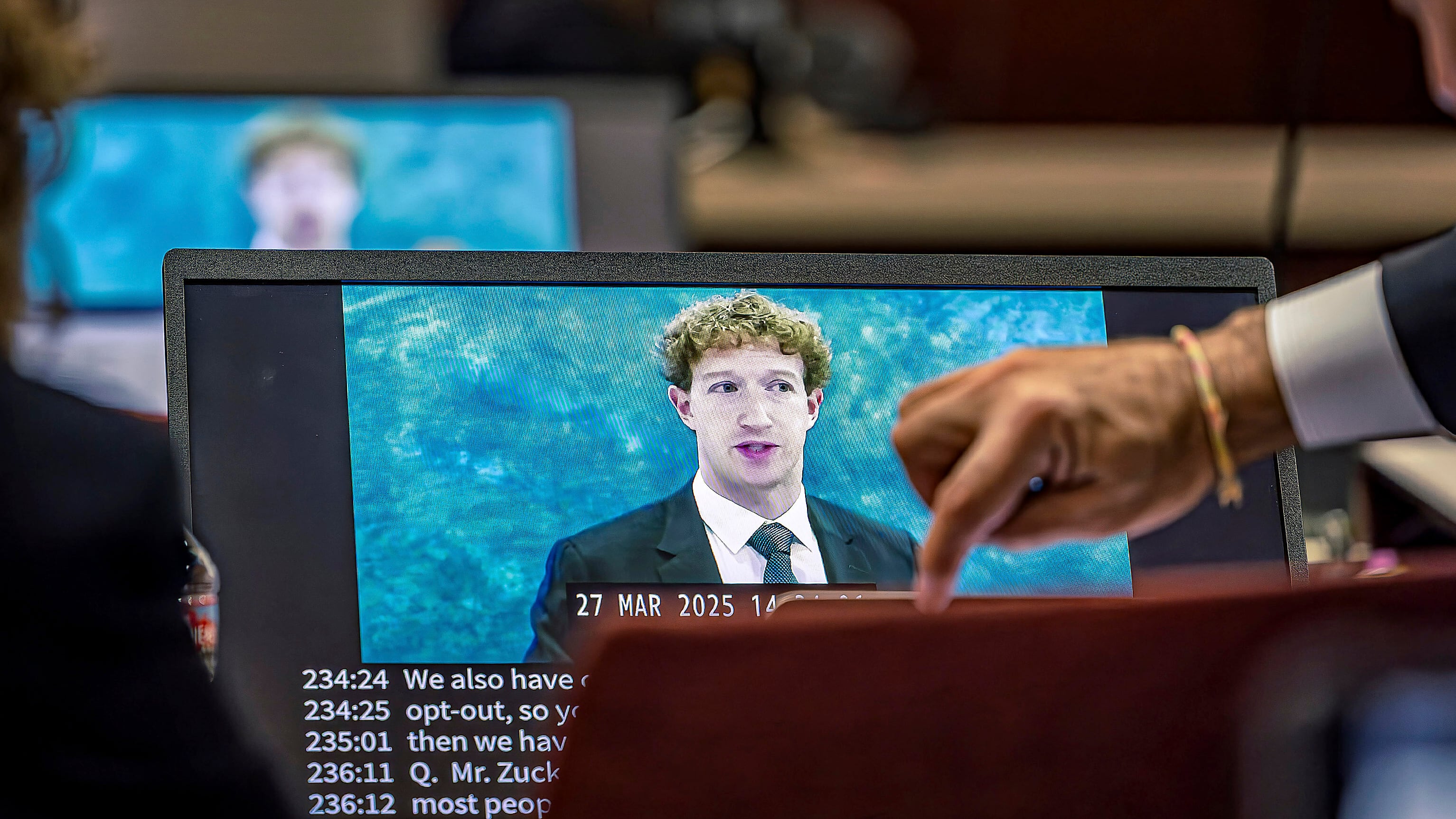 Lawyers for the plaintiff watch on a laptop as a recording of Meta founder and CEO Mark Zuckerberg's deposition is played for the jurors in Santa Fe, N.M., on March 4, 2026. (Jim Weber / Santa Fe New Mexican via AP, Pool)