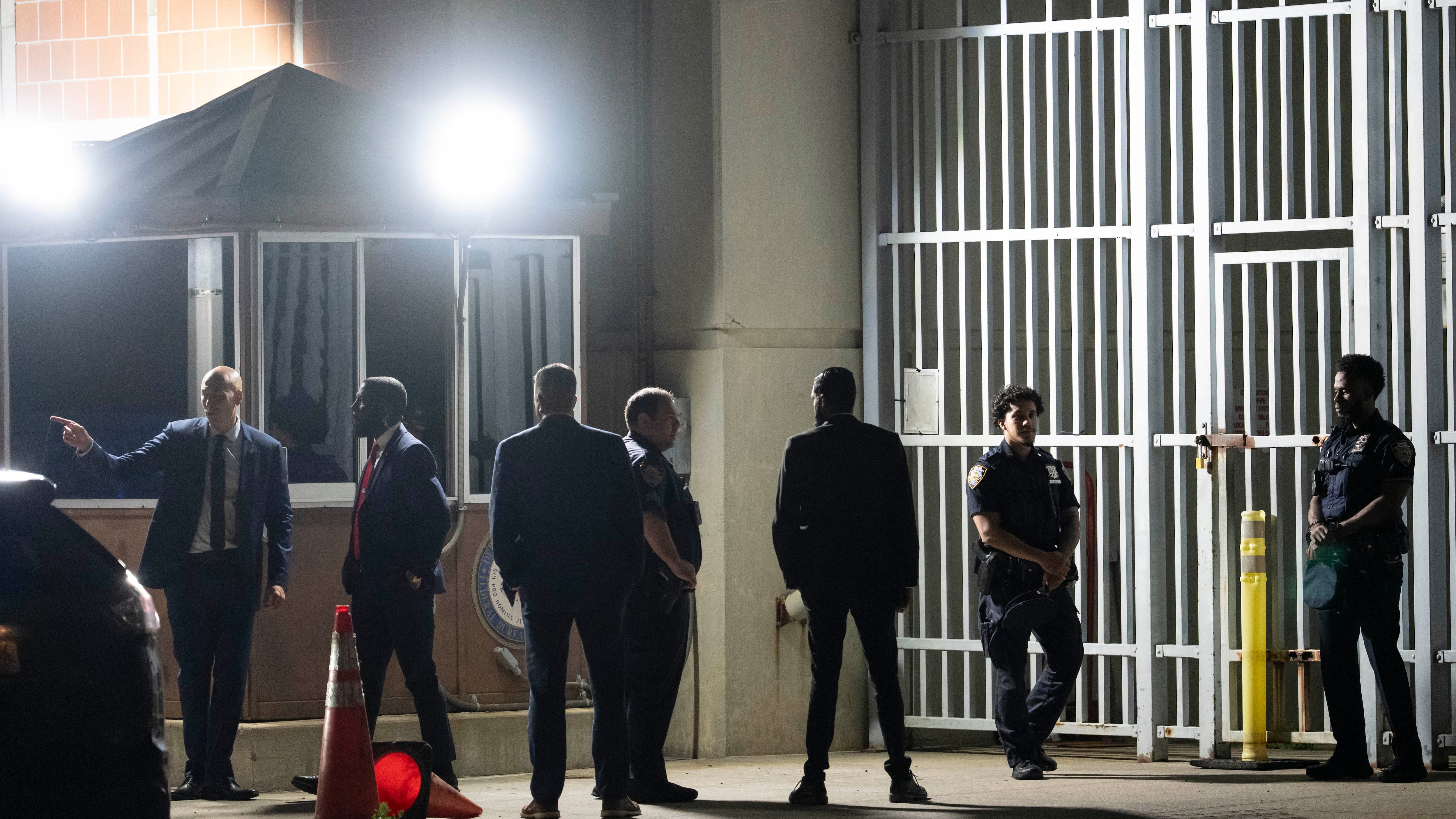 Law enforcement officers stand outside Metropolitan Detention Center ahead of a pre-trial hearing in former Venezuela president Nicolas Maduro's drug trafficking case in the Brooklyn borough of New York on July 22, 2026. (Yuki Iwamura / AP Photo)