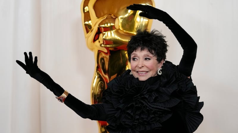 America Ferrera stuns in sparkly Barbie pink, Rita Moreno waves in statement black on Oscars carpet