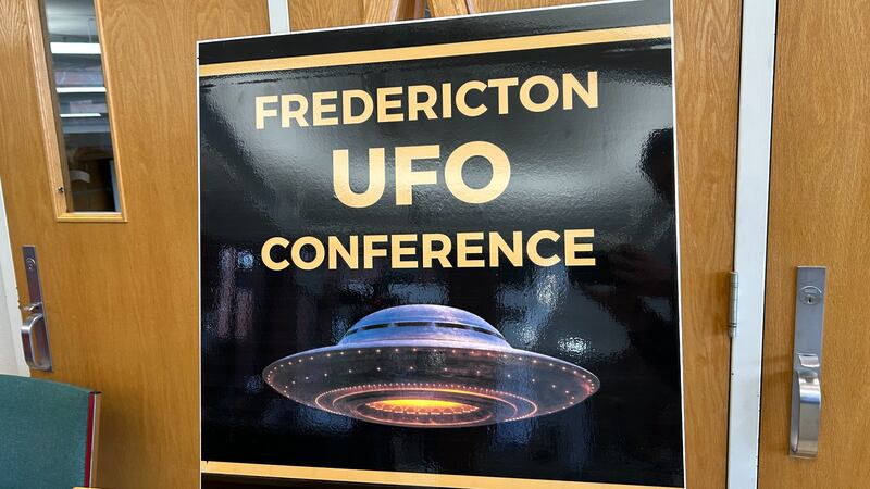 A poster for the Fredericton UFO Conference is pictured. (Avery MacRae, CTV Atlantic)