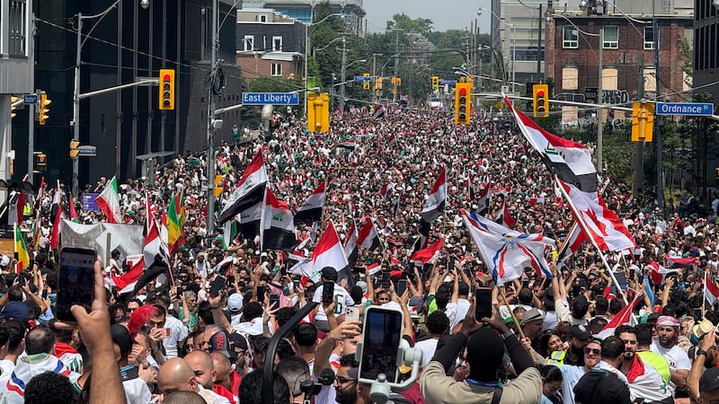 Thousands of Iraq fans flood downtown Toronto ahead of World Cup match with Senegal. Live updates here.