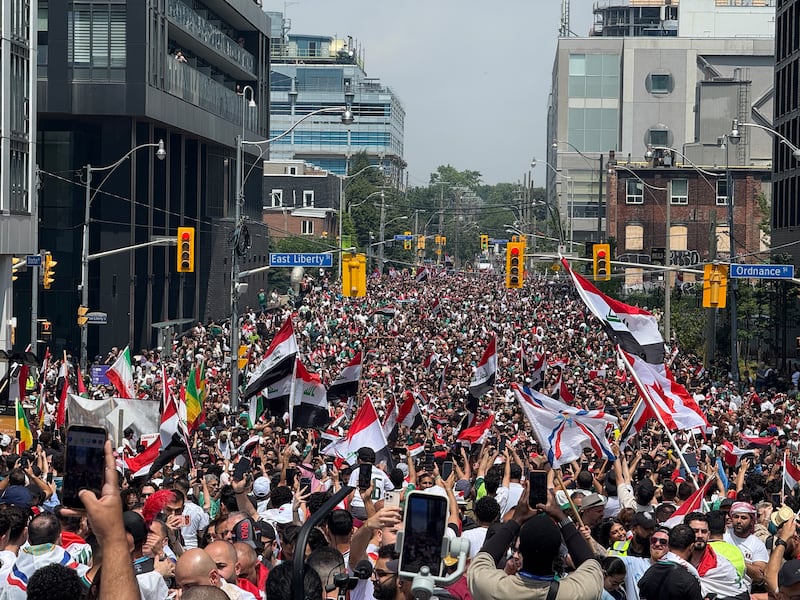 Thousands of Iraq fans flood downtown Toronto ahead of World Cup match with Senegal. Live updates here.