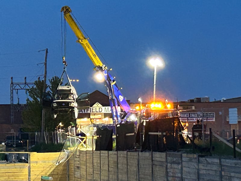 Truck being lifted out of the pit behind Bayfield Mall (CTV News))