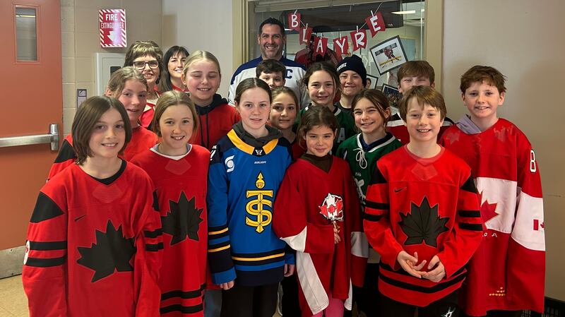 Students from G.R. Saunders Elementary School in Stellarton, N.S., cheer on hometown hockey hero Blayre Turnbull on Feb. 19, 2026. (Emma Convey/CTV News Atlantic)