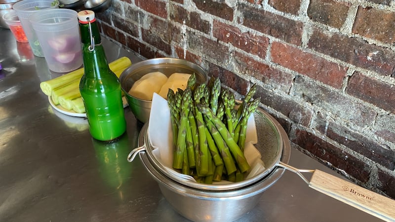 A bowl of asparagus is pictured.