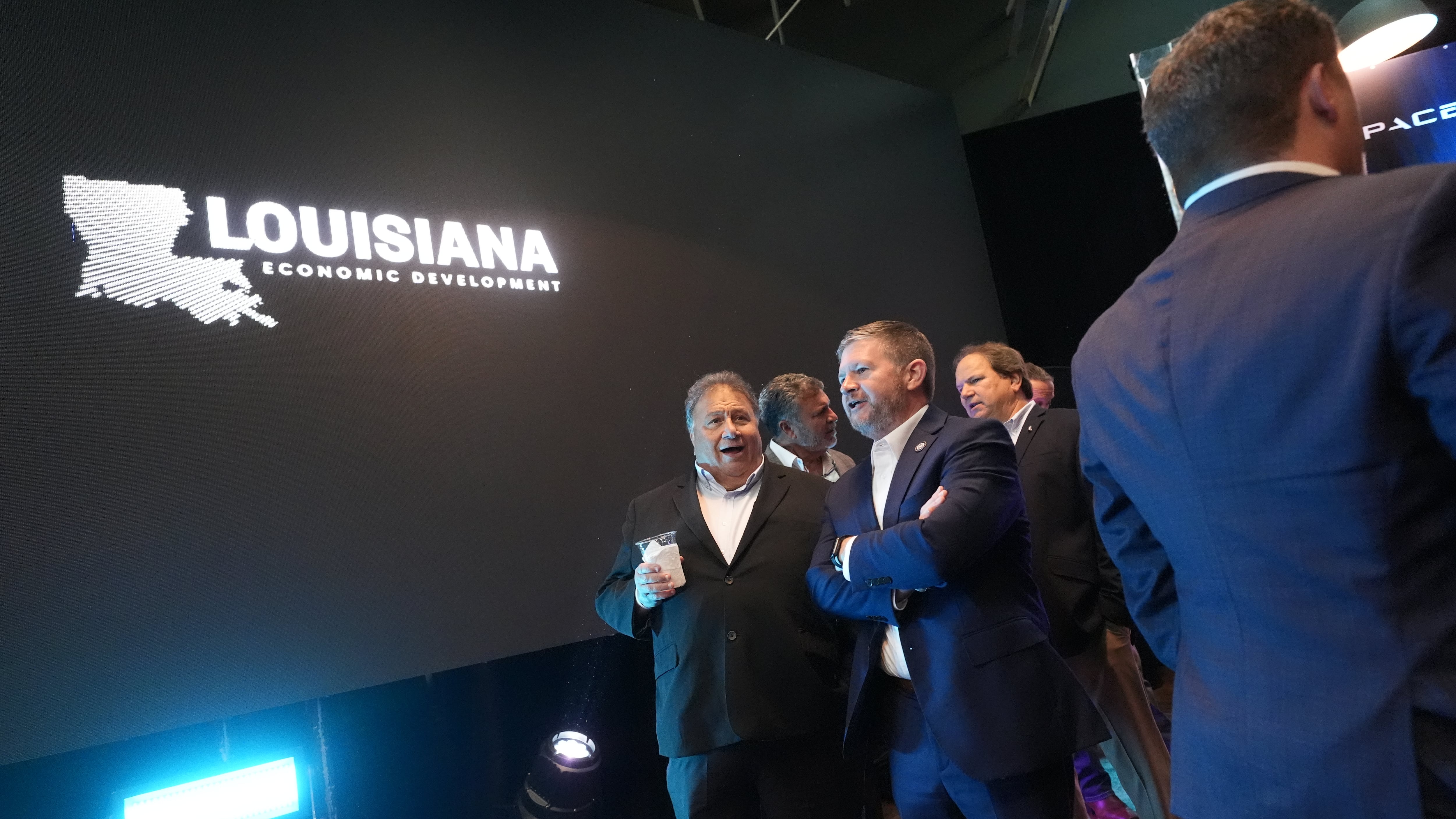 Guests gather before the start of an event with Louisiana Gov. Jeff Landry and SpaceX announcing a deal to build a new spaceport in Louisiana in Abbeville, La., on Aug. 25, 2026. (Gerald Herbert / AP Photo)