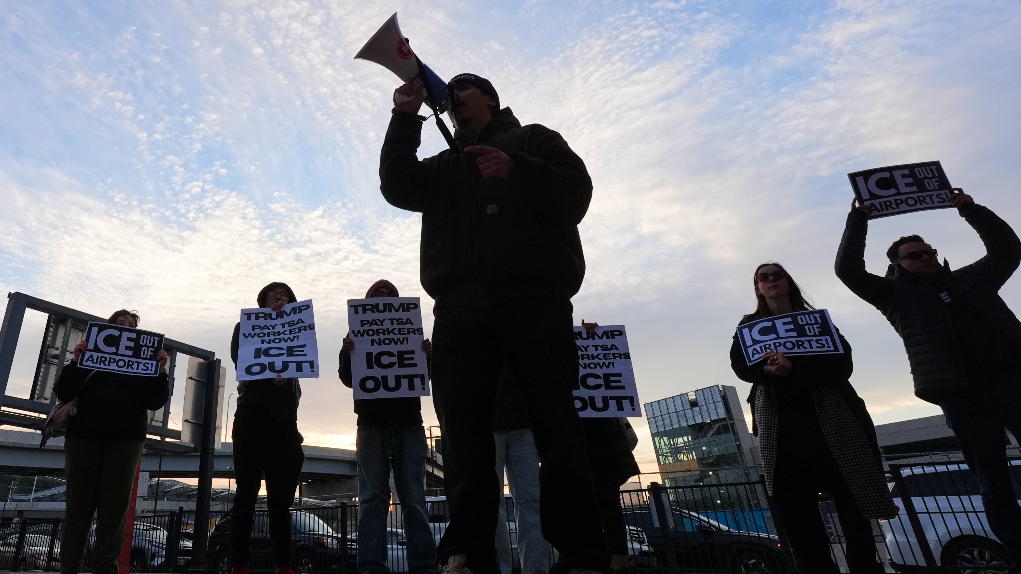 People gather outside Terminal 4 at John F. Kennedy International Airport to protest the use of Immigration and Customs Enforcement officers in New York on March 25, 2026. (Frank Franklin II / AP Photo)