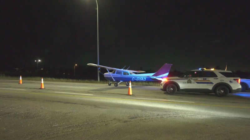 RCMP redirect traffic after the pilot of a Cessna 172 had to make an emergency landing in the southbound lanes of Highway 21, between Highway 16 and Baseline Road, in Strathcona County, in the early morning of Sept. 16, 2026. (Evan Klippenstein / CTV News Edmonton)