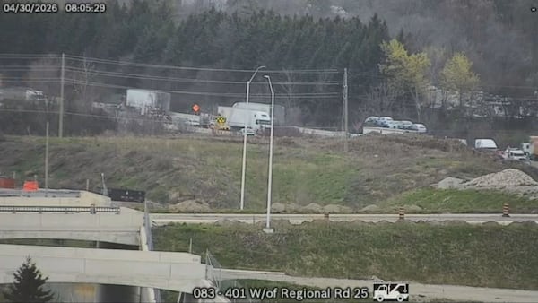 ‘Really jammed up:’ Drivers face challenging commute on Hwy. 401 after truck slams into guardrail