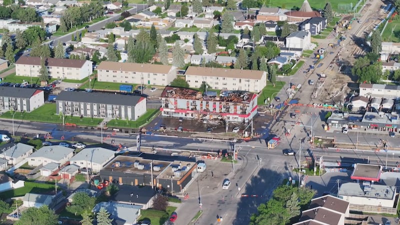 An aerial view of an apartment building at 82 Street and 132 Avenue in Edmonton the morning after a fatal fire on July 13, 2026. (Sean McClune / CTV News Edmonton)
