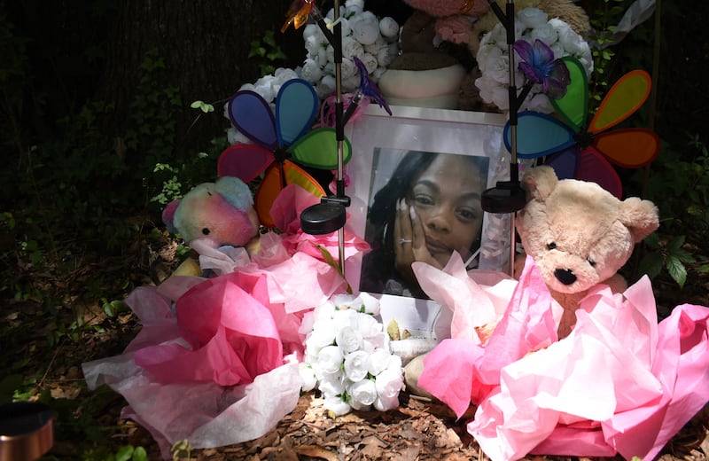 A makeshift memorial is pictured on Aug. 10, 2026, in Jackson, Miss., honouring Tasia Fortune in the backyard of the property where her body was found. (Sophie Bates / AP Photo)