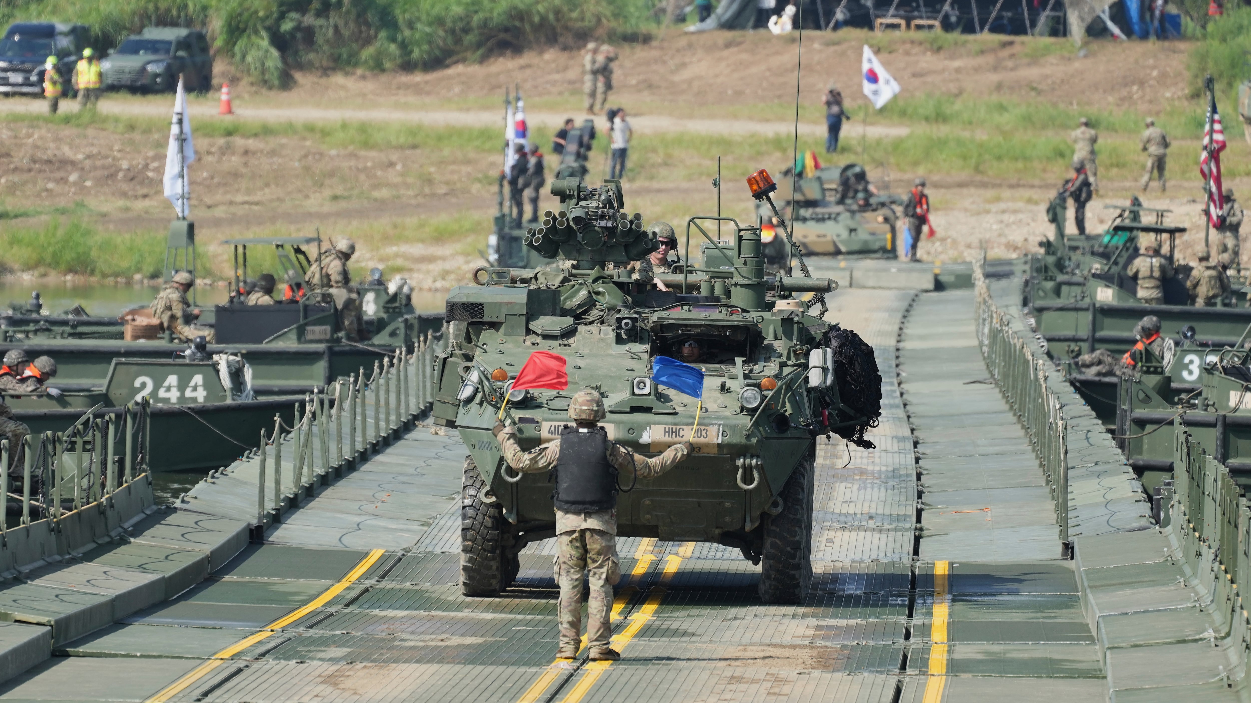 A U.S. army vehicle crosses a floating bridge on the Namhan River during the combined river-crossing drill between South Korea and the United States in Yeoju, South Korea on Aug. 27, 2025. (Lee Jin-man / AP Photo)