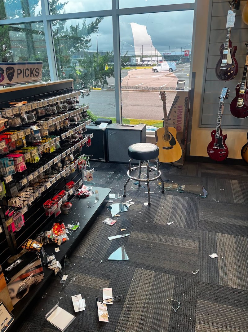 Someone smashed a rock through the window of a Long & McQuade store in Moncton, N.B., before stealing a rare guitar. (Long & McQuade/Facebook)