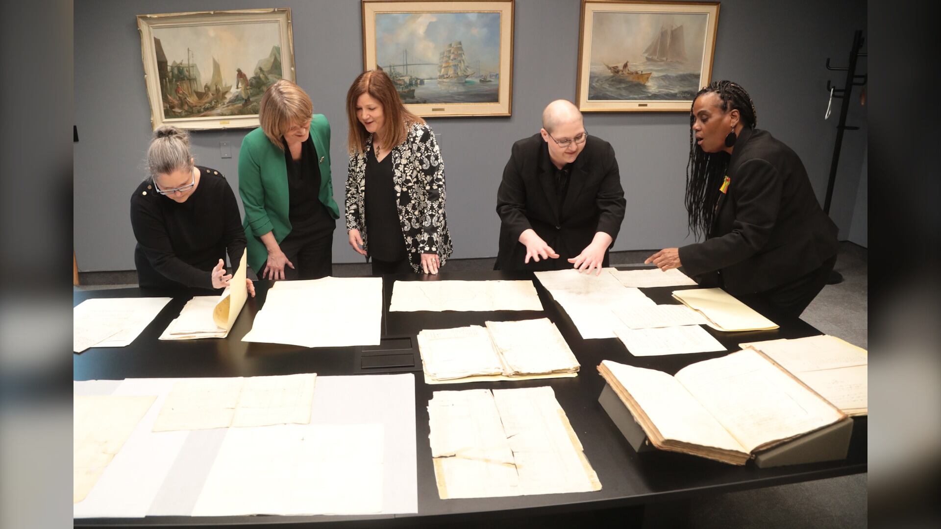 Award recipients are pictured reviewing documents from the collection titled Black Loyalists in Canada: Autonomy, Advocacy, Community, Legacy, recognized Saturday by the Canadian Commission for UNESCO. (Courtesy: Susan McKeage)