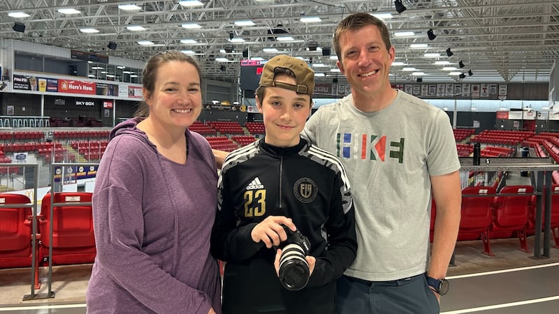 Young sports photographer Zac Boone of Truro, N.S., is pictured with his parents, Sara and Andrew. (Emma Convey/CTV Atlantic)