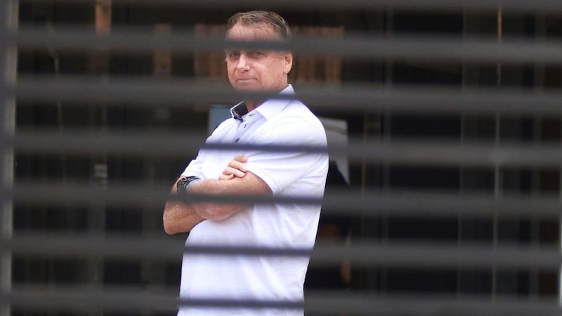 Brazilian police search former president Bolsonaro’s home for weapons