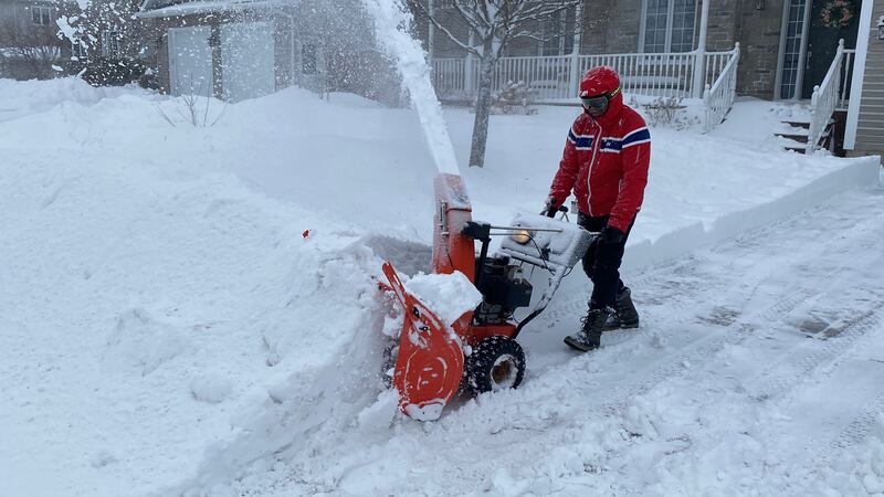 A man is pictured with a snowblower on Willshire Way in the north end Moncton, N.B., on Feb. 24, 2026. (Derek Haggett/CTV Atlantic)