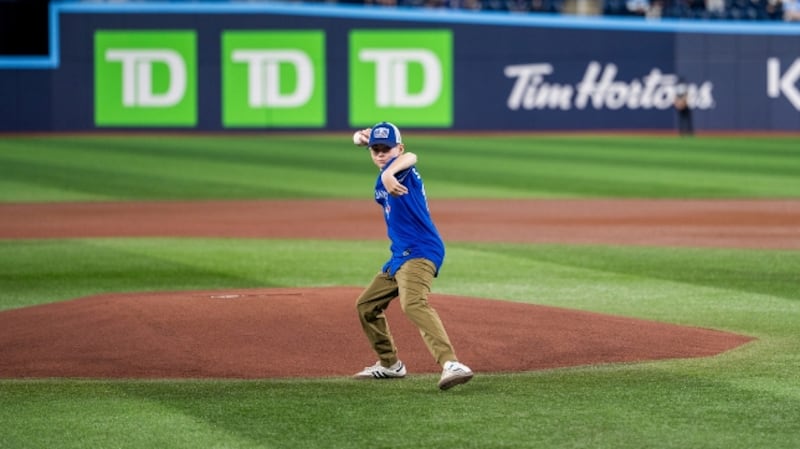 Blake Savage is pictured throwing out the first pitch at a Blue Jays game in Toronto. (Source: Toronto Blue Jays)