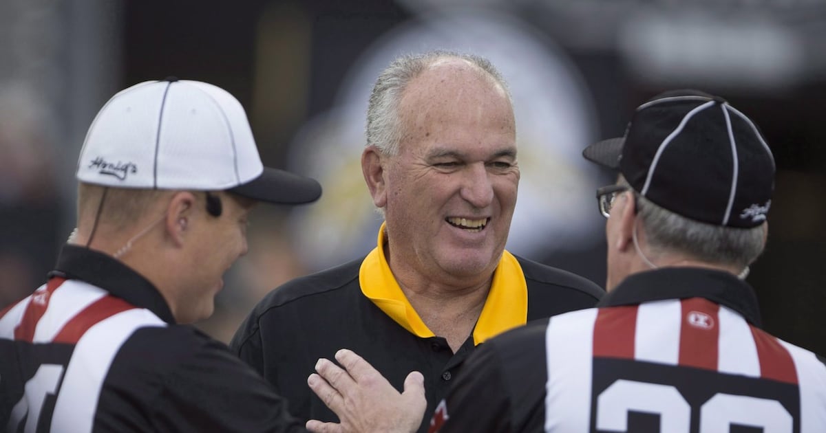 Photo: CP24 Tiger-Cats head coach June Jones speaks with officials before a CFL game against the Toronto Argonauts in Hamilton, Ont., on