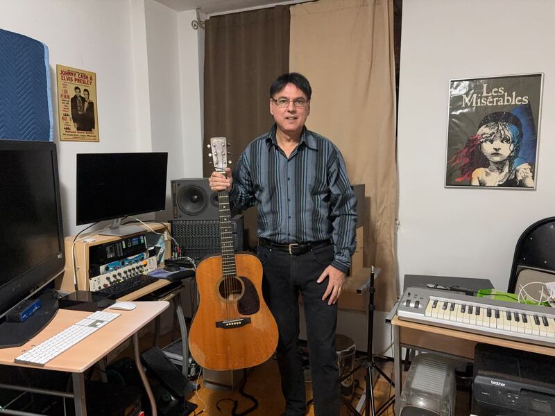Peter Linseman in his Toronto studio with the 1954 Martin D-18 guitar believed to have belonged to Johnny Cash.