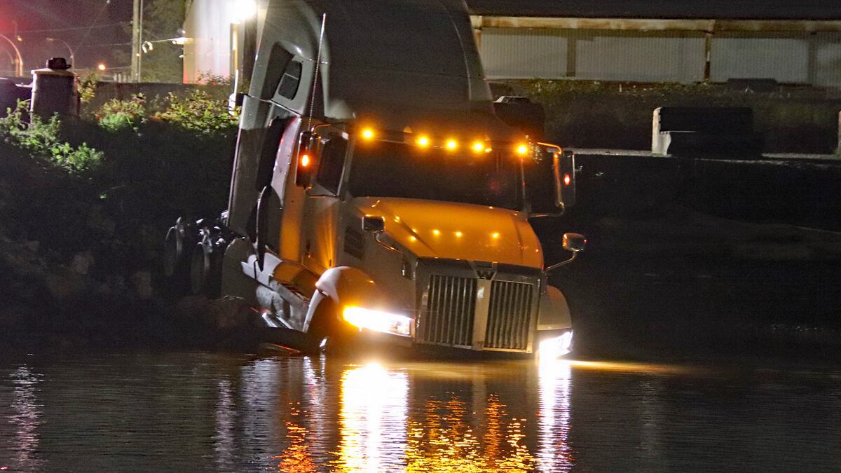 Mounties say a man got out of the submerged truck and was arrested.