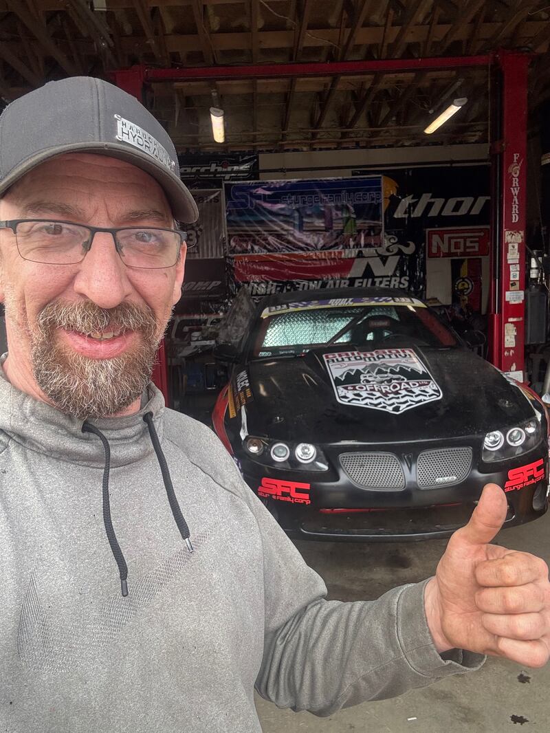 Shane Ganong poses with one of his cars in the garage of his new home in Fort McMurray, Alta., in this Thursday, April 30, 2026 handout photo. THE CANADIAN PRESS/Handout - Shane Ganong (Mandatory Credit)
