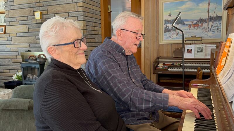 Cedric Landers plays a song for his wife Marina at their home in Lutes Mountain, N.B., on Jan. 31, 2026. (Derek Haggett / CTV Atlantic)