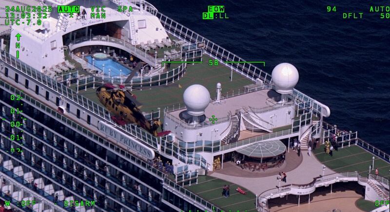 An RCAF Cormorant helicopter is pictured above the Ruby Princess cruise ship off Tofino, B.C. (Royal Canadian Air Force/U.S. Coast Guard)