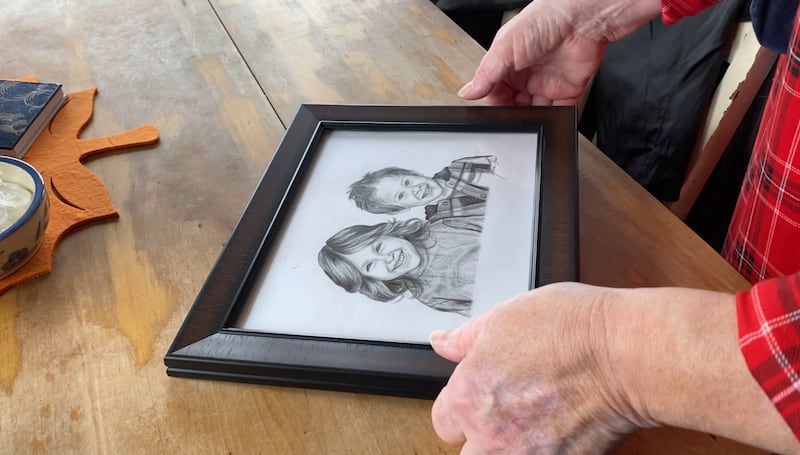 Belynda Gray holds a drawing of her grandchildren, Lilly and Jack Sullivan, at her home in Upper Musquodoboit, N.S., on Oct. 21, 2025. (Hafsa Arif/CTV News Atlantic)