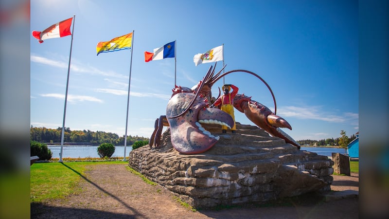 The giant lobster statue is pictured with his companion, the fisherman, in Shediac, N.B. (Source: Town of Shediac)