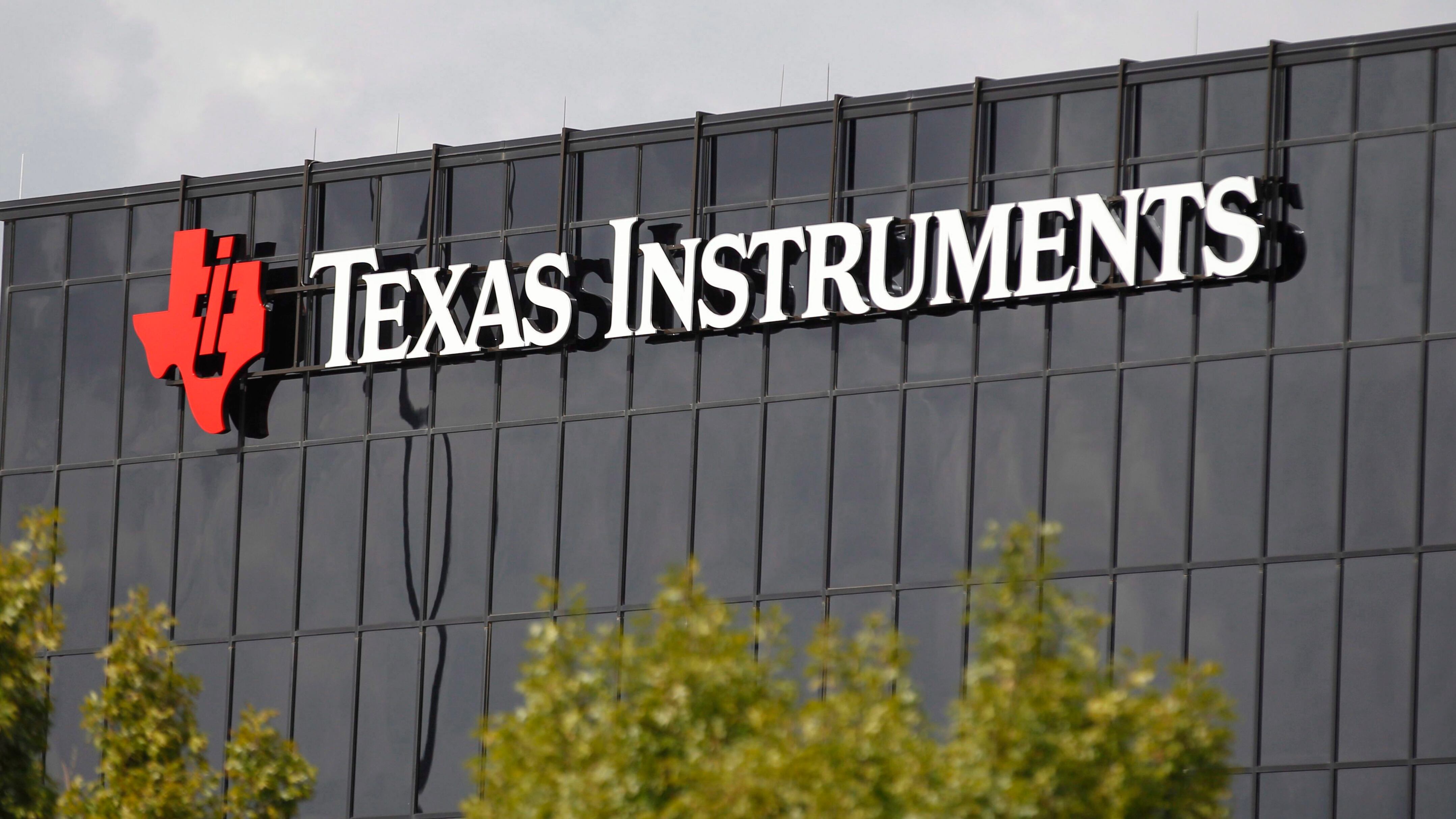Corporate signage on the offices of Texas Instruments, in Richardson, Texas. On Tuesday, July 17, 2018. (AP Photo/LM Otero, File)