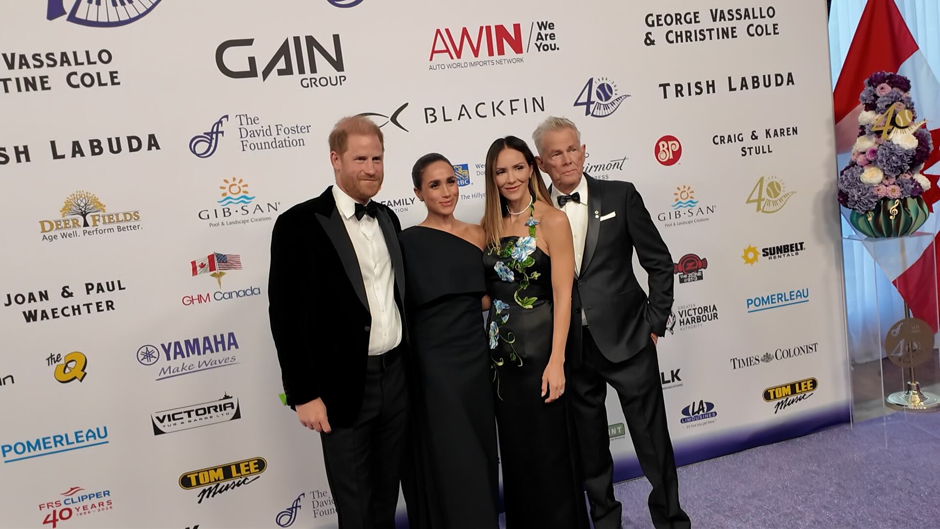 David Foster, Katharine McPhee, Meghan Markle and Prince Harry pose for photographers at the David Foster Foundation’s 40th anniversary gala in Victoria on Friday, Aug. 7, 2026.