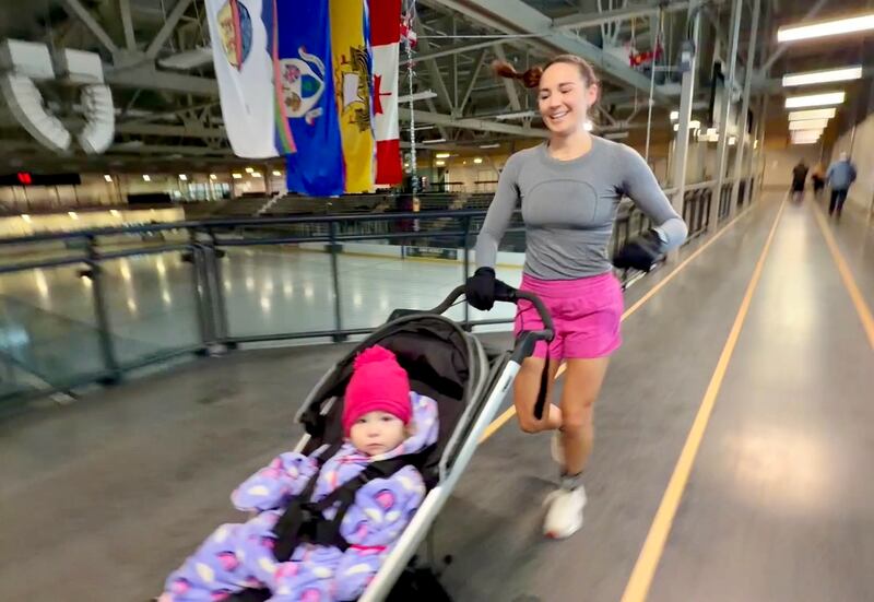 Julia Reid-Howell runs at a place very familiar to her and 17-month-old Winnie: The Grant-Harvey arena in Fredericton.