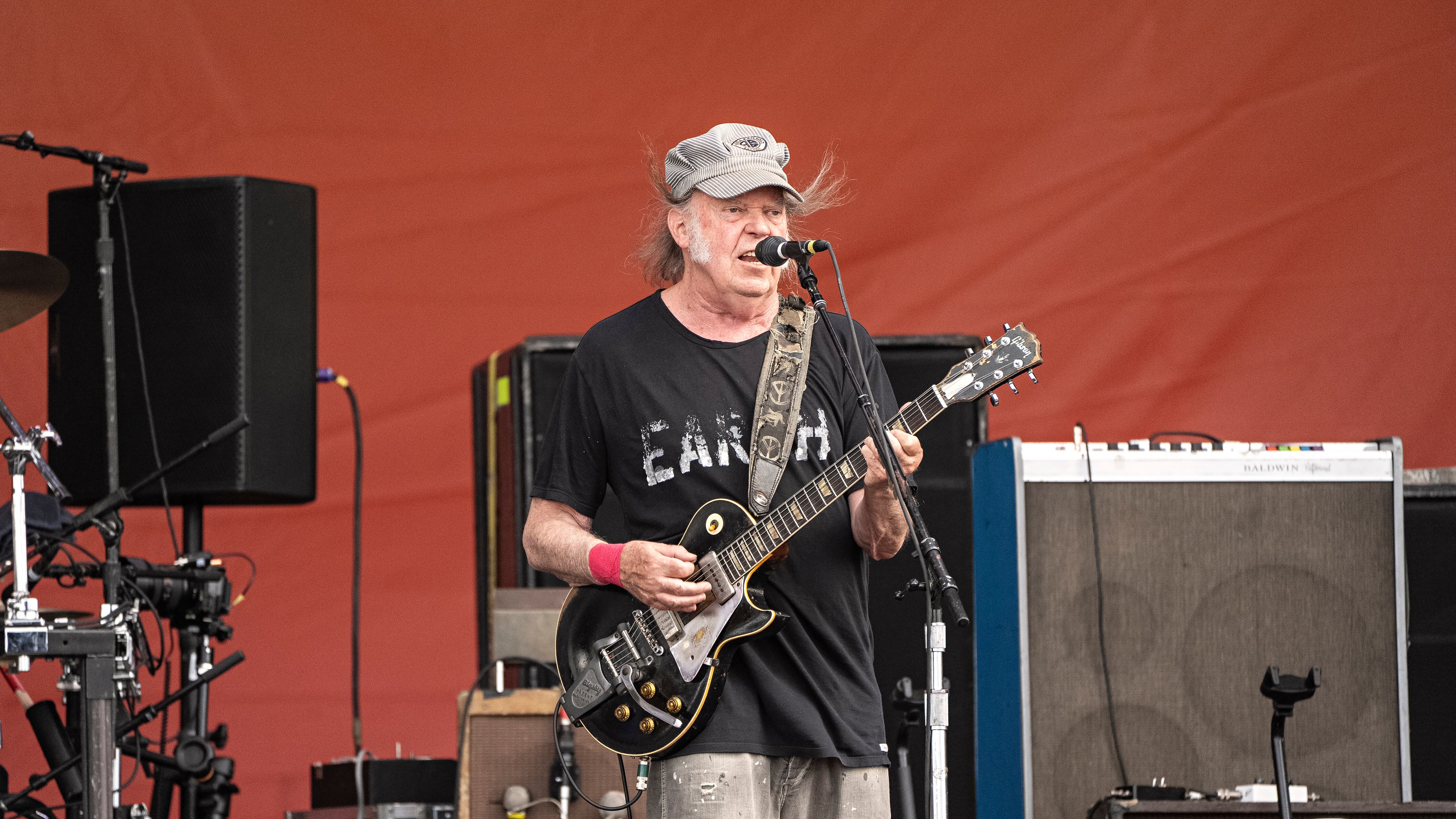 Neil Young performs during the New Orleans Jazz & Heritage Festival, Saturday, May 4, 2024, at the Fair Grounds Race Course in New Orleans. (Photo by Amy Harris/Invision/AP)