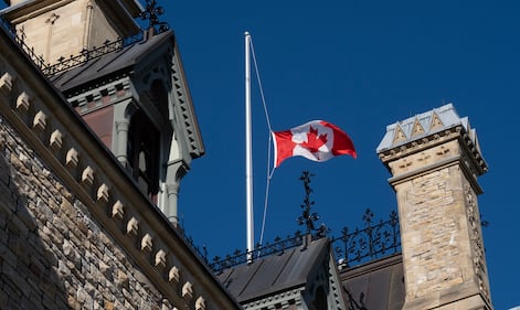 A Canadian flag on West Block flies at half mast to mark the incident at CFB Wainwright, in Ottawa, Monday, Oct. 19, 2026. THE CANADIAN PRESS/Adrian Wyld