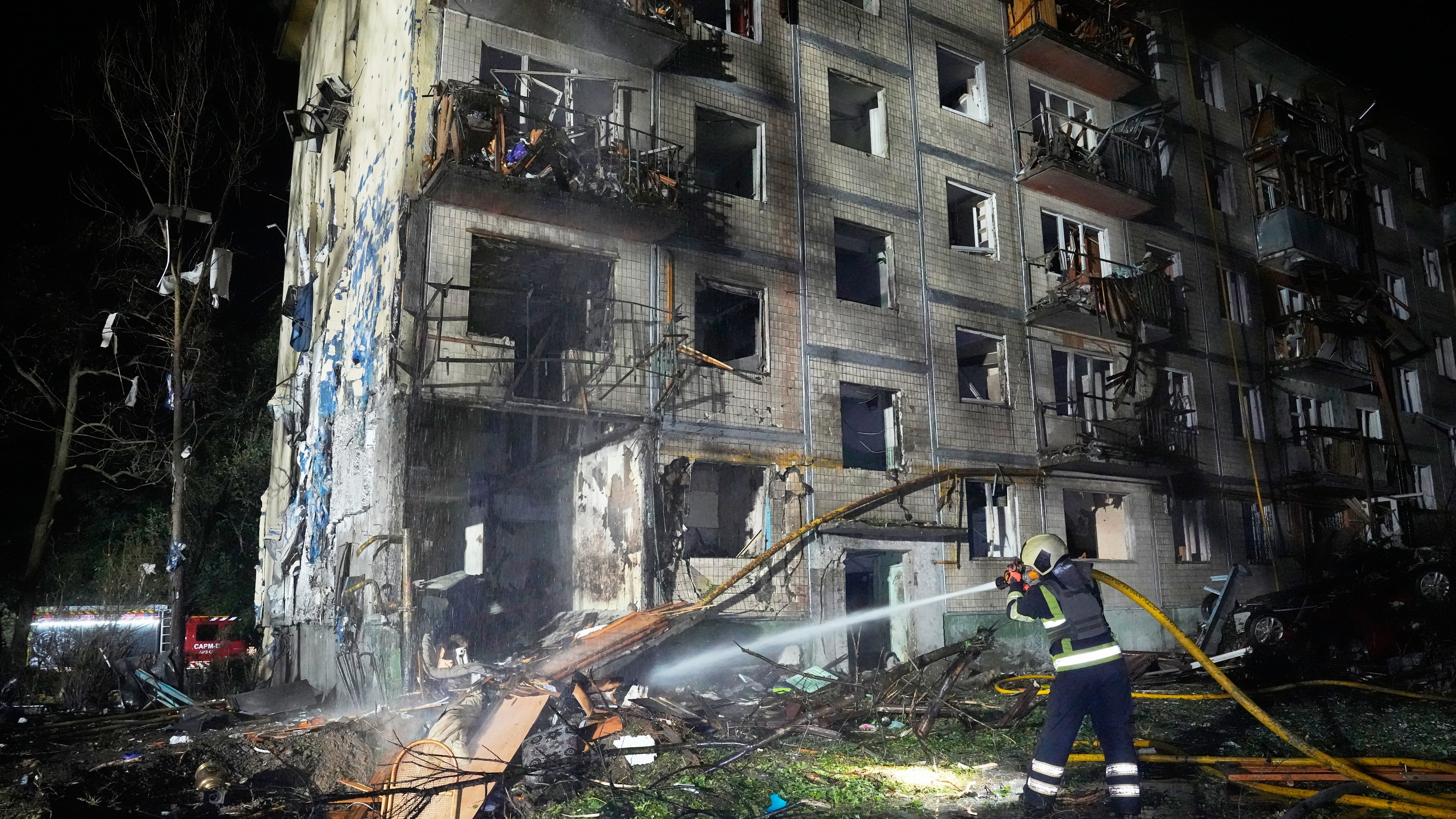 Emergency services personnel work to extinguish a fire following Russian missile attacks in Kyiv, Ukraine on Aug. 1, 2026. (Efrem Lukatsky / AP Photo)