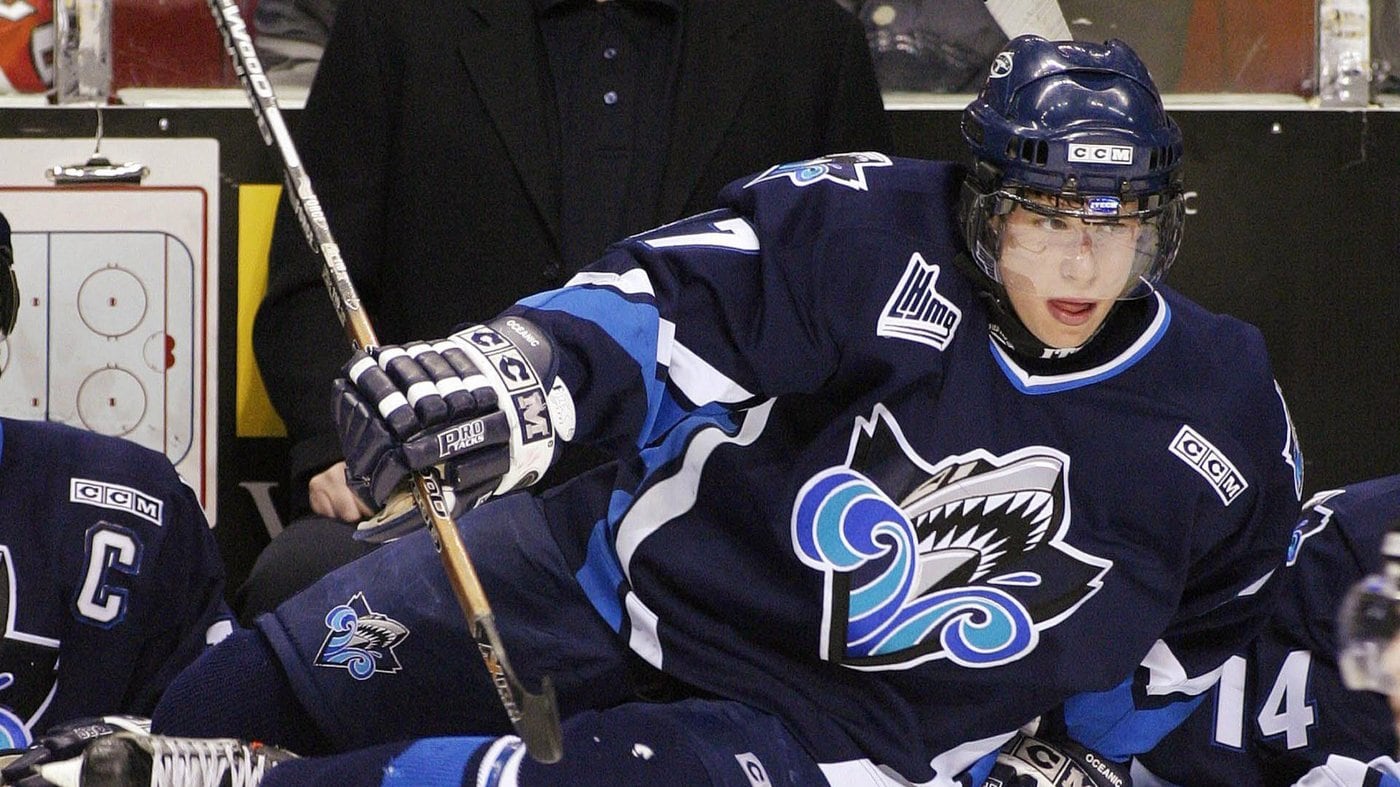 Sidney Crosby dons a blue Rimouski Oceanic jersey and hockey helmet as he jumps over the boards at a QMJHL game in December 2003.