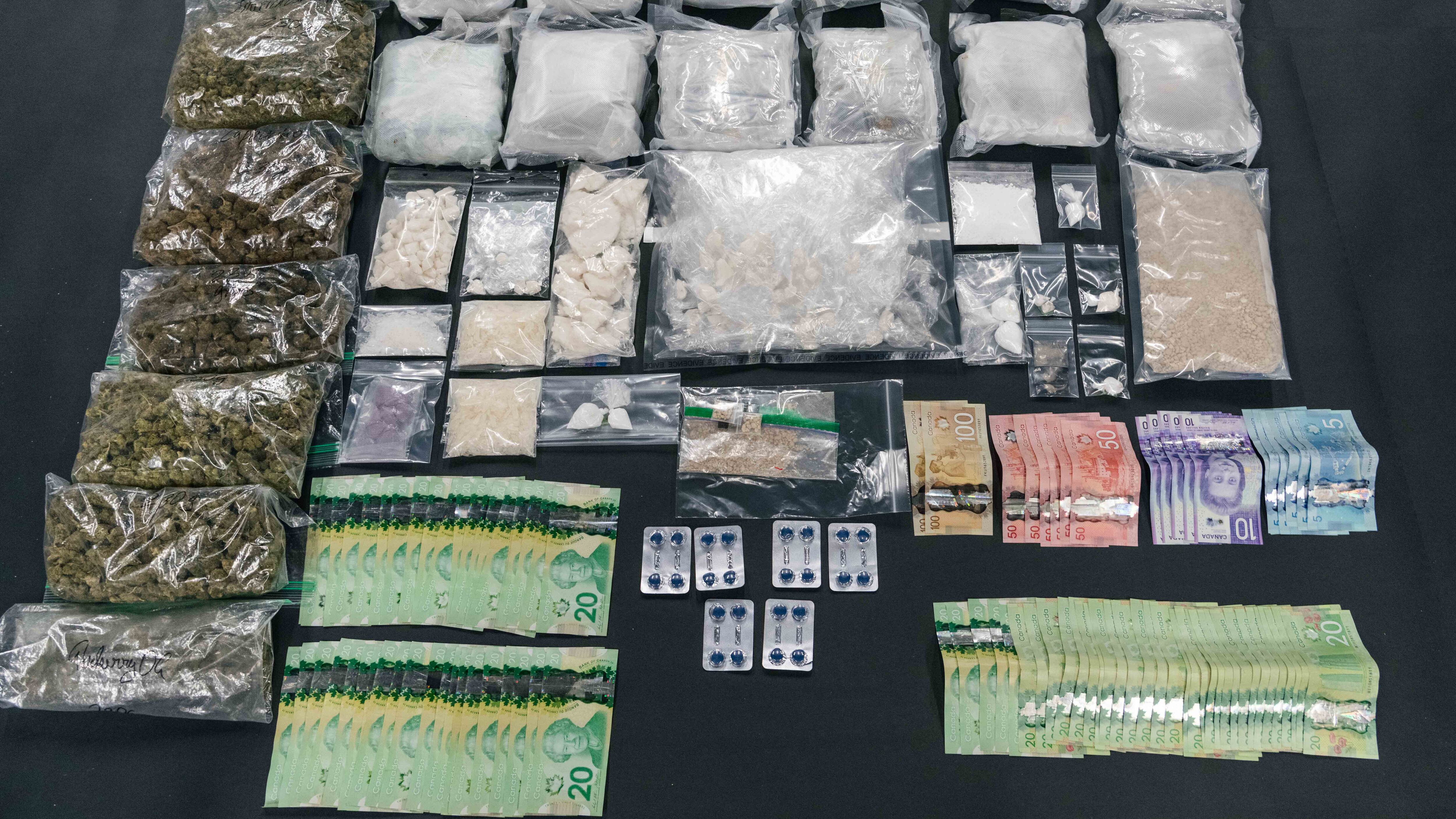 Detectives executed a search warrant at a home in Surrey, B.C., with assistance from the Canada Border Services Agency and the heavily armed Lower Mainland District Emergency Response Team. (Handout)