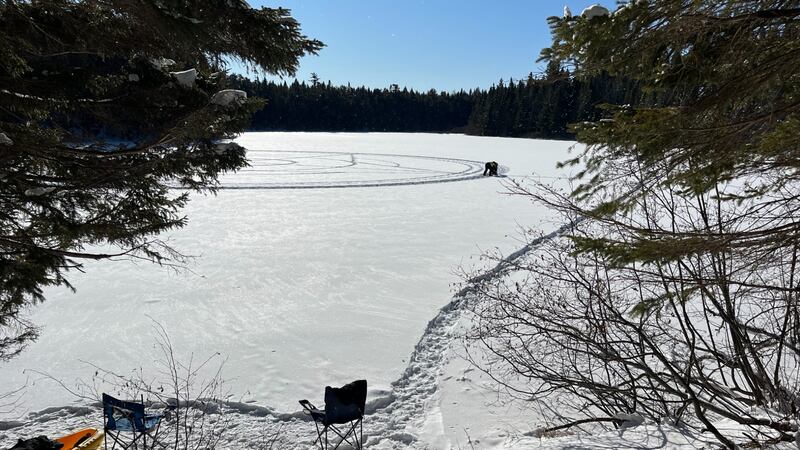 A frozen lake covered in snow is pictured.